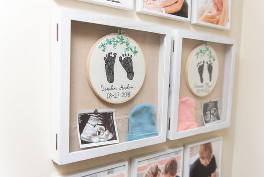 Embroidered baby feet with leaf design