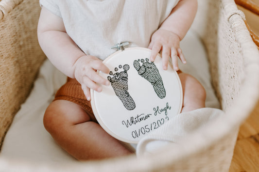 Embroidered baby feet in hoop based on actual inked feet from birth