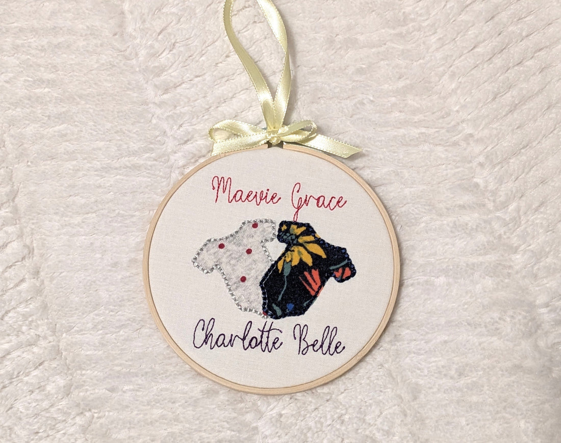 custom embroidered ornament with baby bodysuit fabric as the applique design