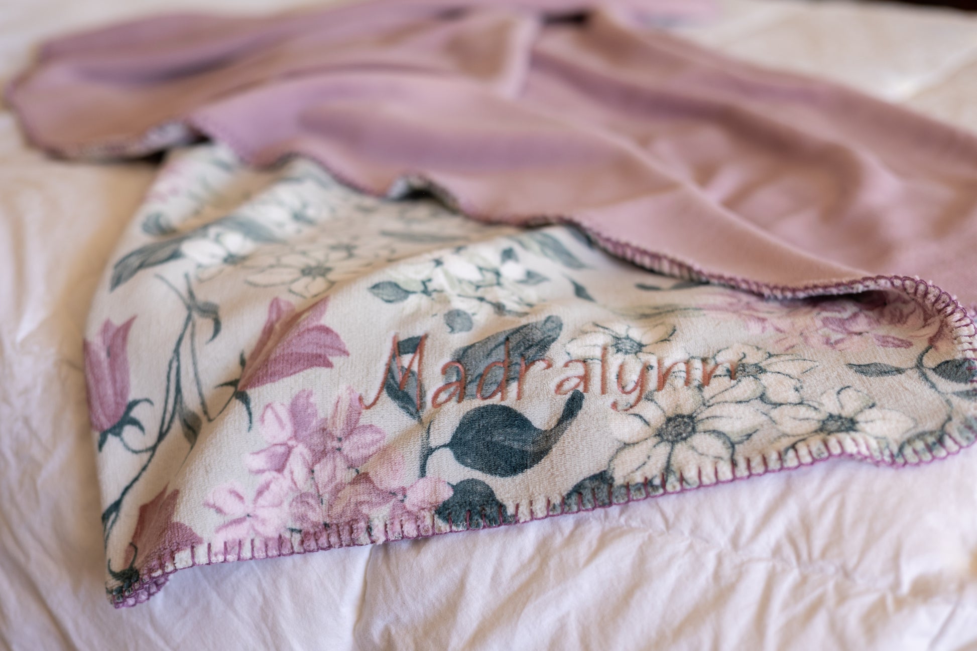 Personalized name embroidered in the corner of a soft throw blanket