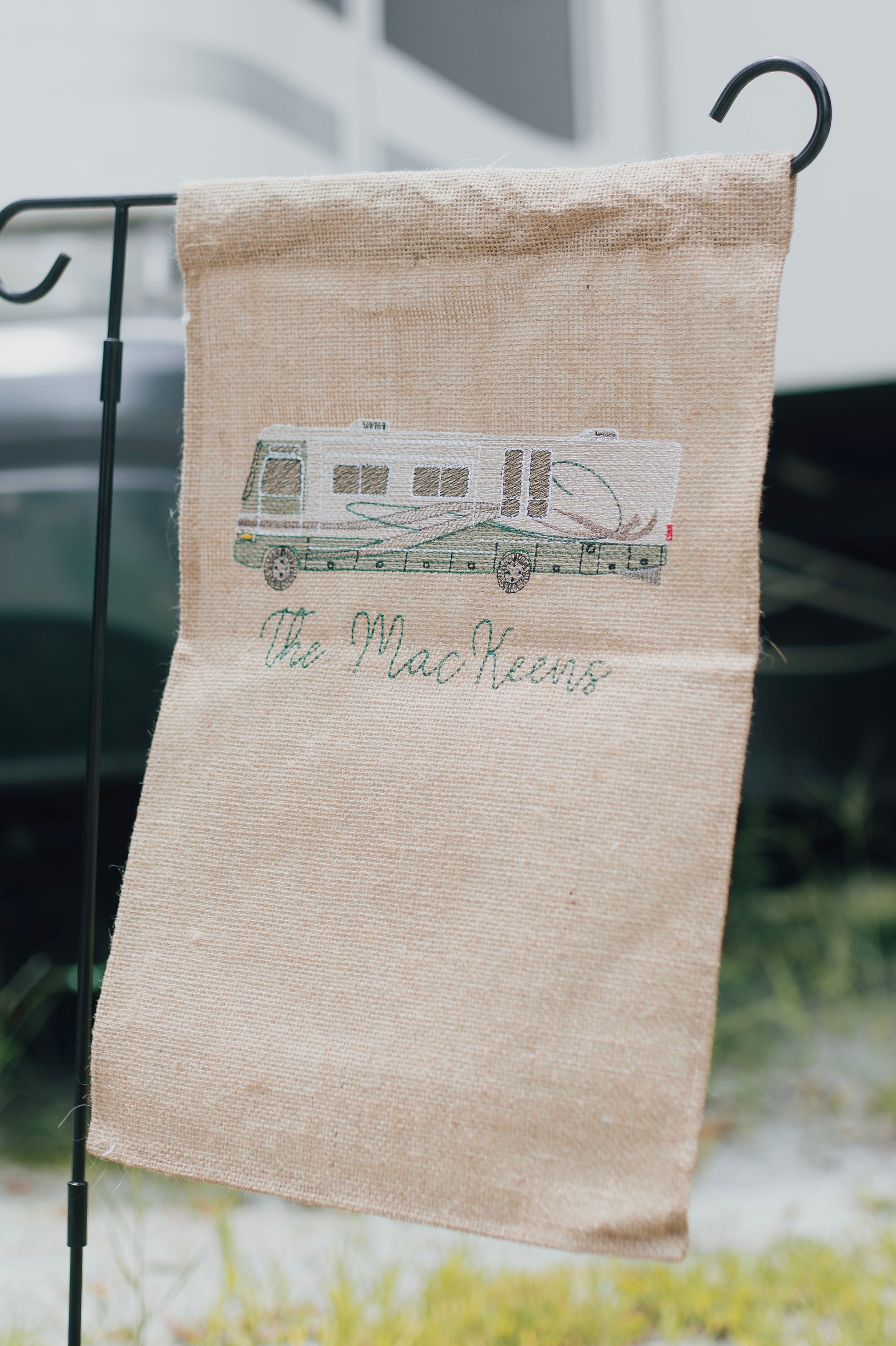 Custom embroidered camper on a burlap garden flag