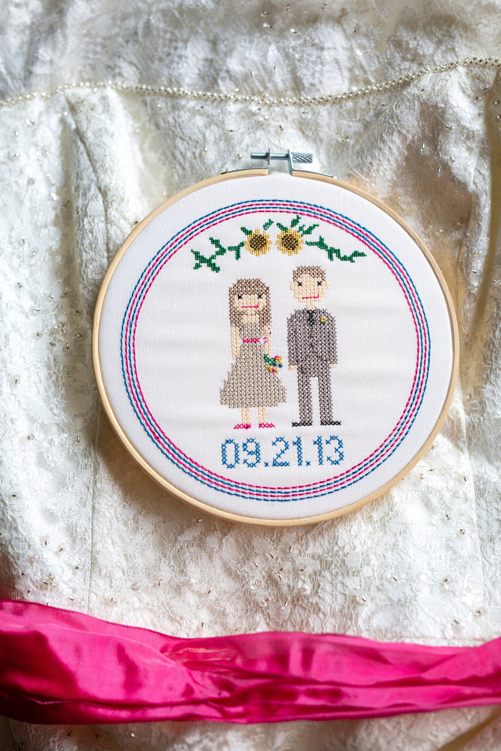 Embroidered cross stitch couple with wedding decor details