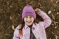 Personalized knit beanie with an embroidered name in colored thread