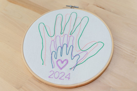 Family hands embroidered in hoop