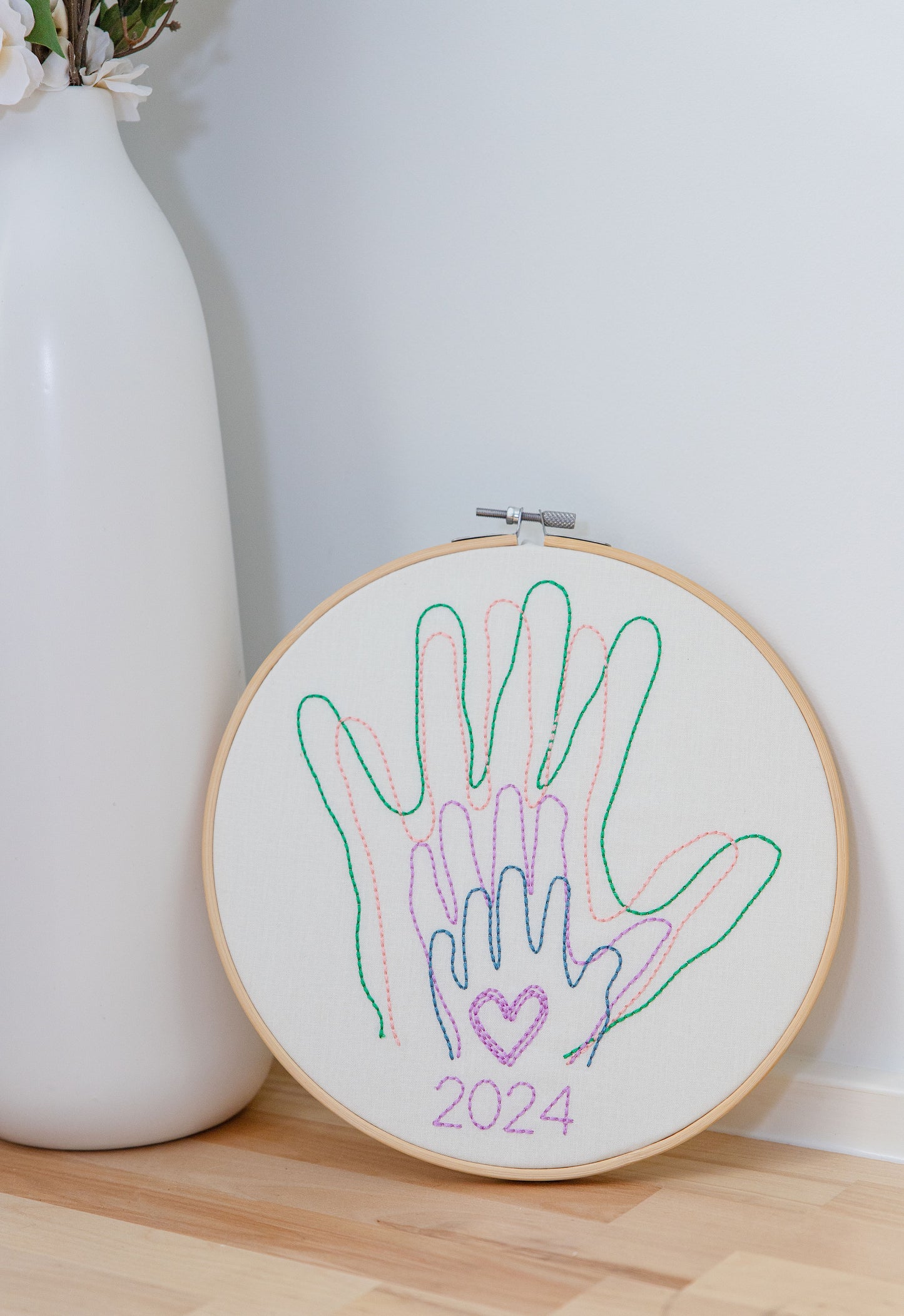 Family hands embroidered in hoop