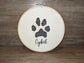 Custom paw print embroidered in a 6 inch wooden hoop