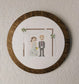 Embroidered cross stitch wedding couple in a wooden frame