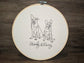 Dogs embroidered line art in embroidery frame