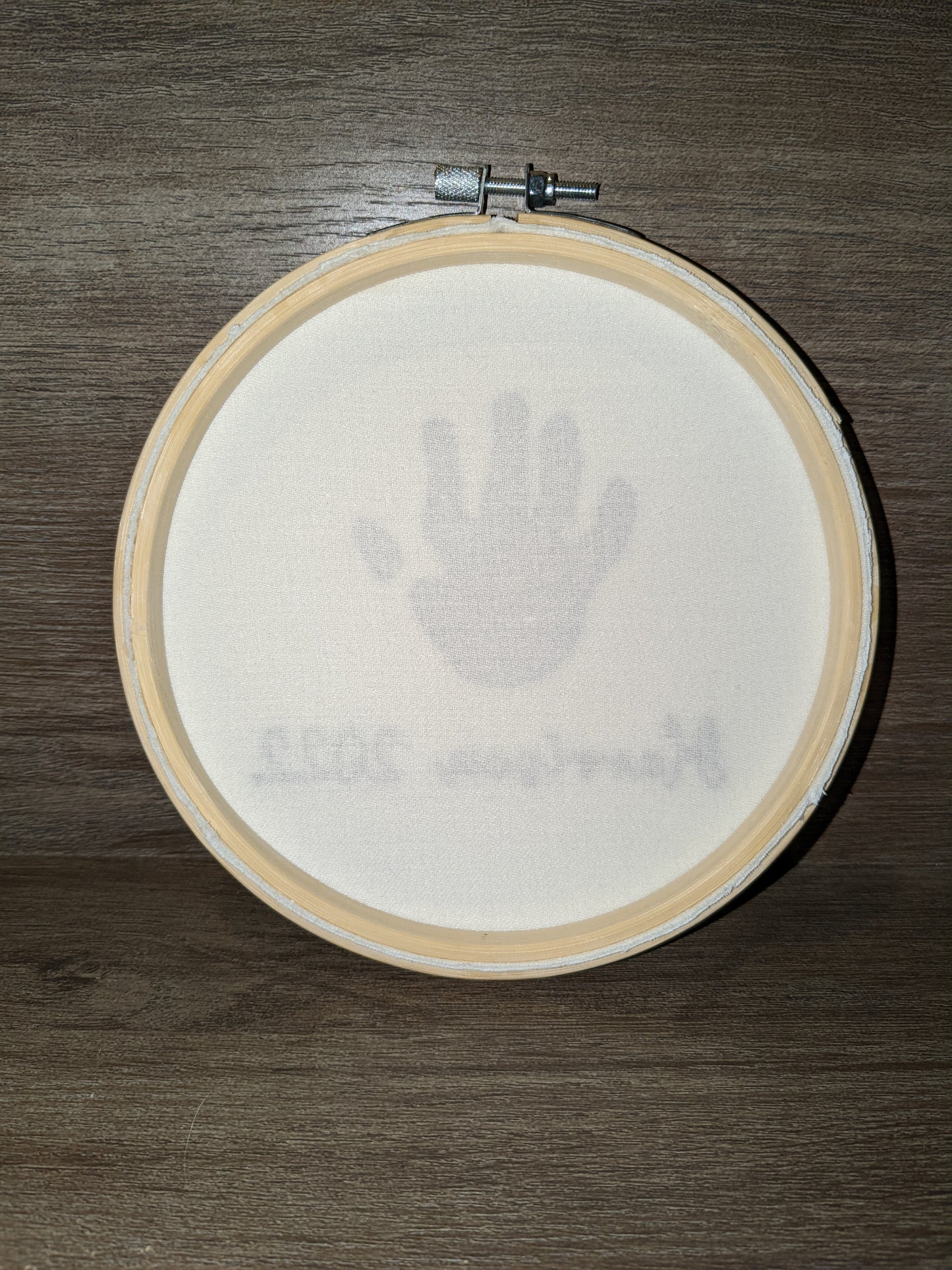 Example of a stamped child handprint with measurement for embroidery