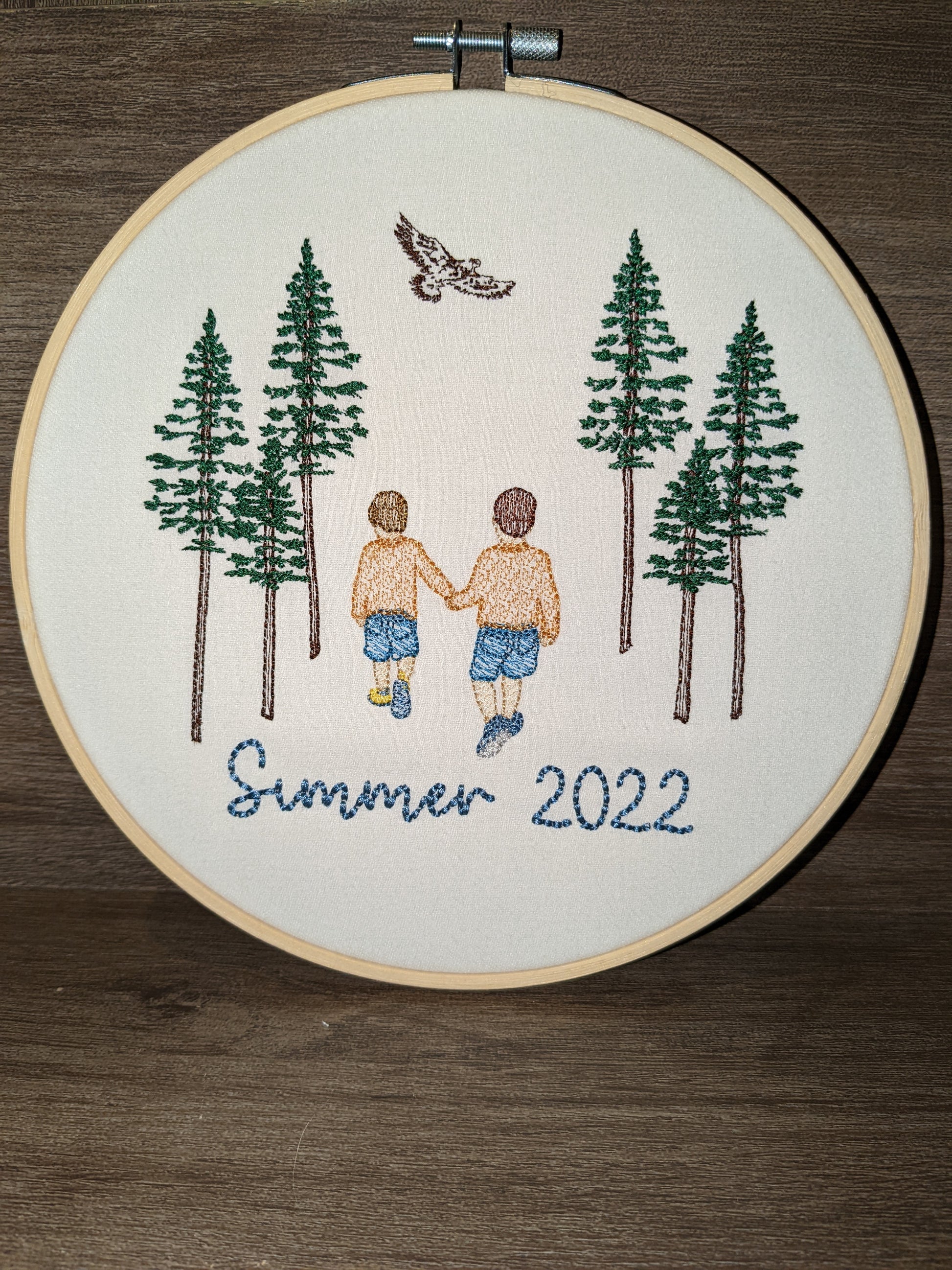 Embroidered wedding portrait in a 7 inch wooden hoop