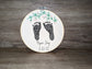 Embroidered baby feet with floral leaf design