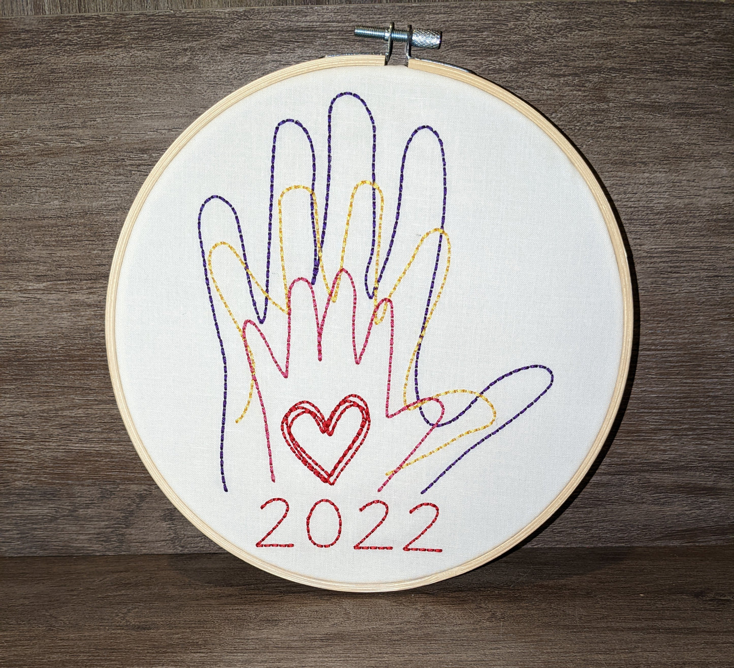 Family hands embroidered in hoop