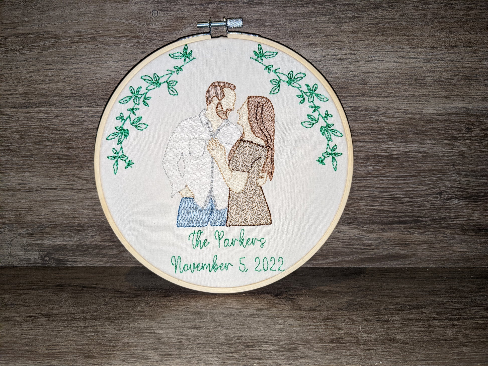 Embroidered wedding portrait in a 7 inch wooden hoop