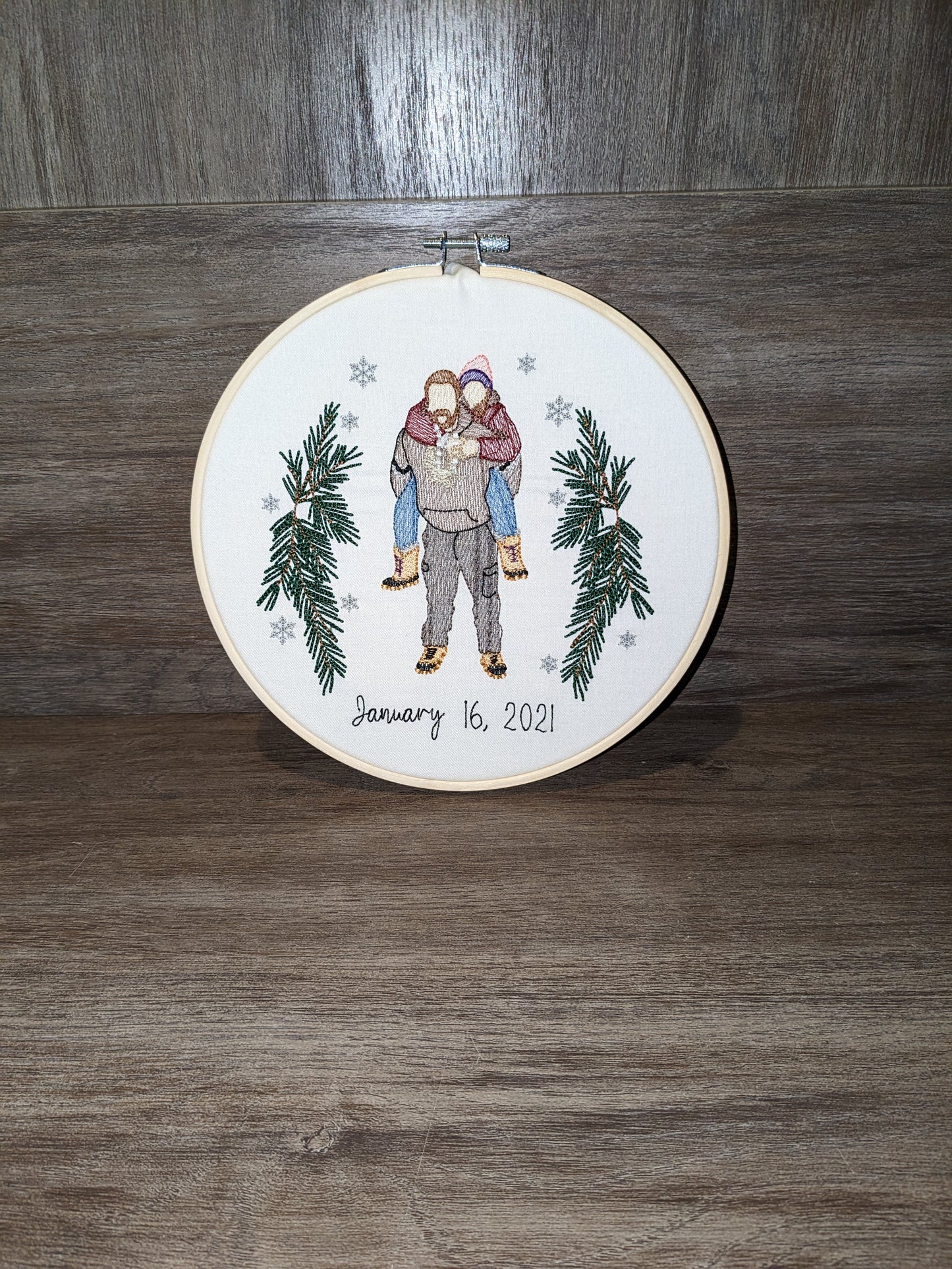 Wedding couple embroidered from a photo in an embroidery hoop