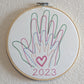 Family hands embroidered in hoop