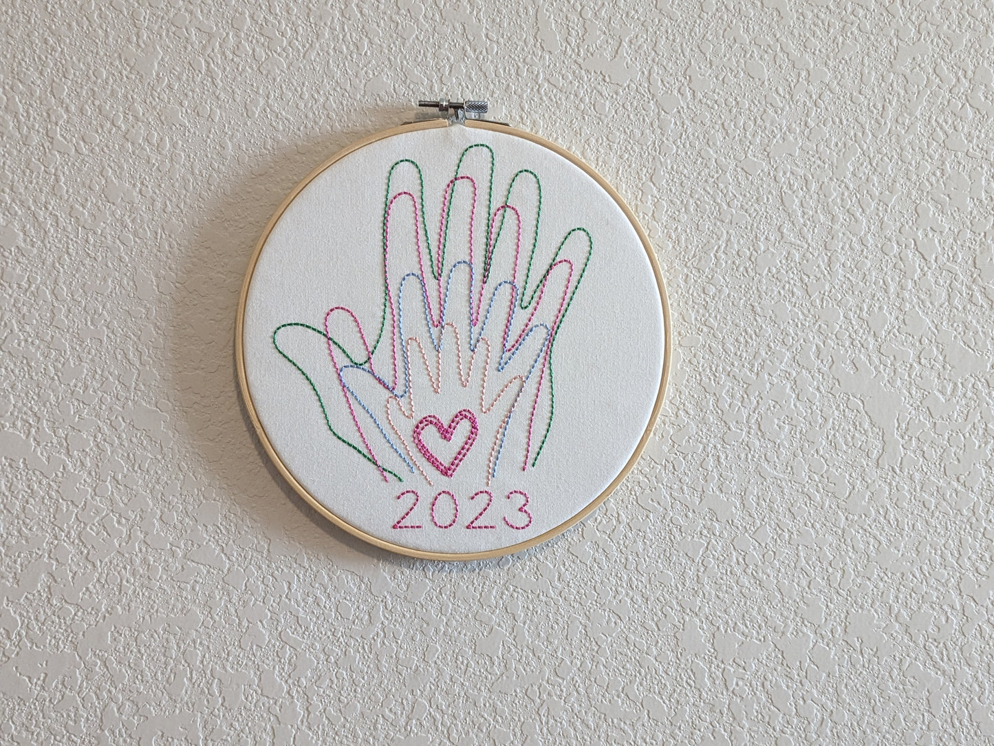 Family hands embroidered in hoop