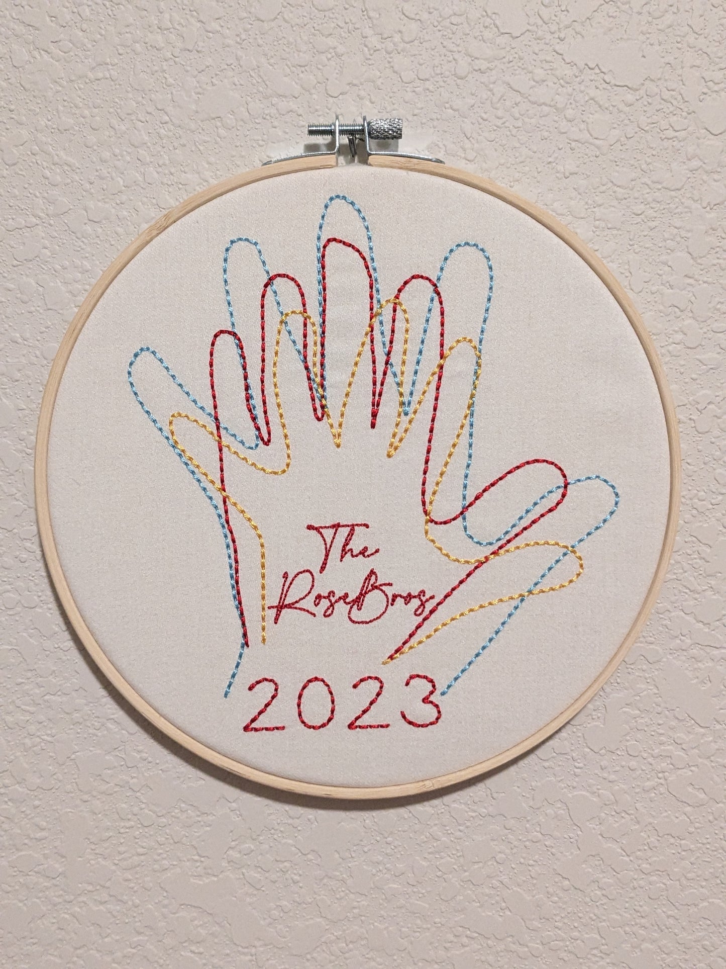 Family hands embroidered in hoop