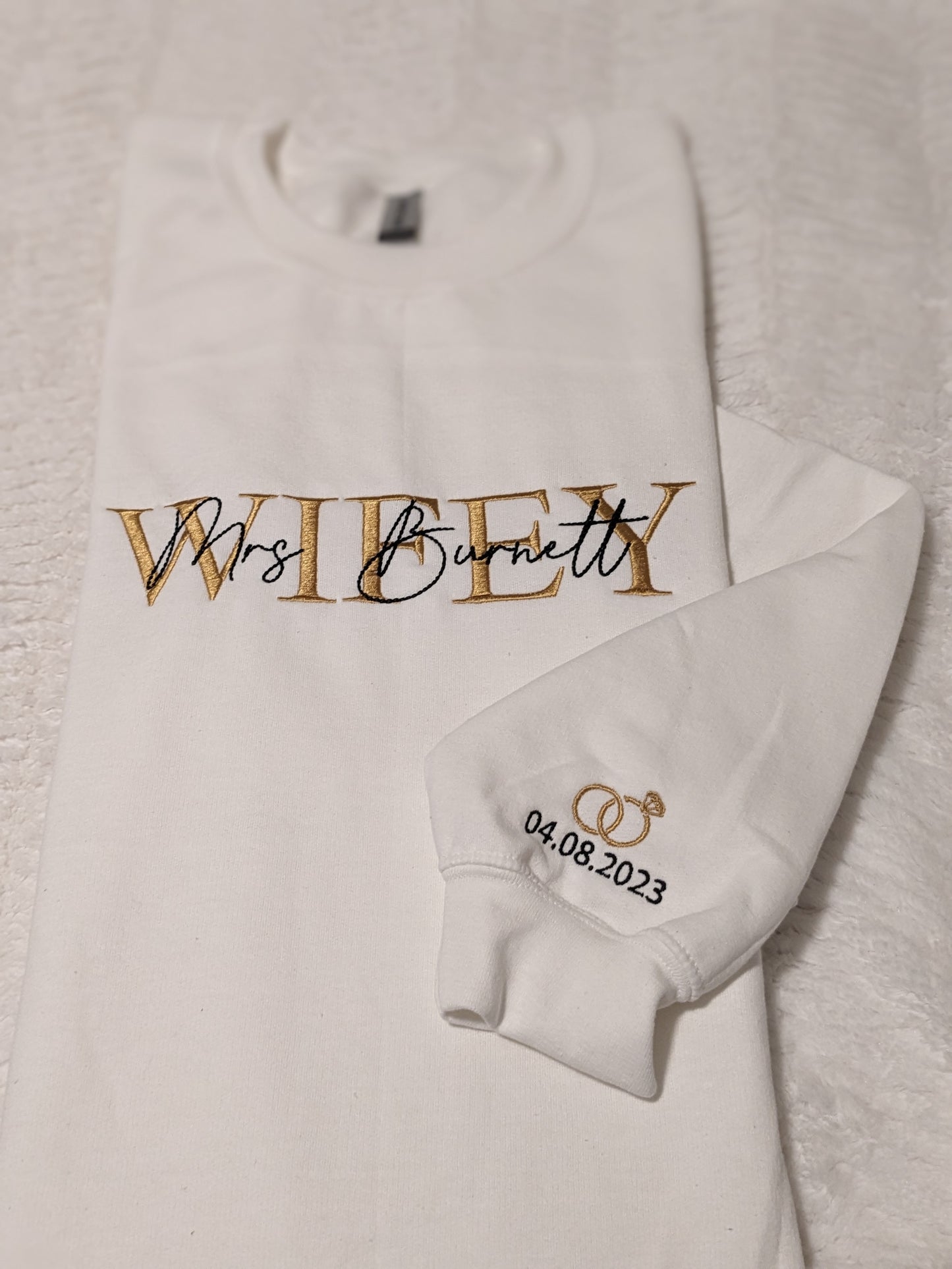 Wifey sweatshirt with Mrs. and last name embroidered on the chest