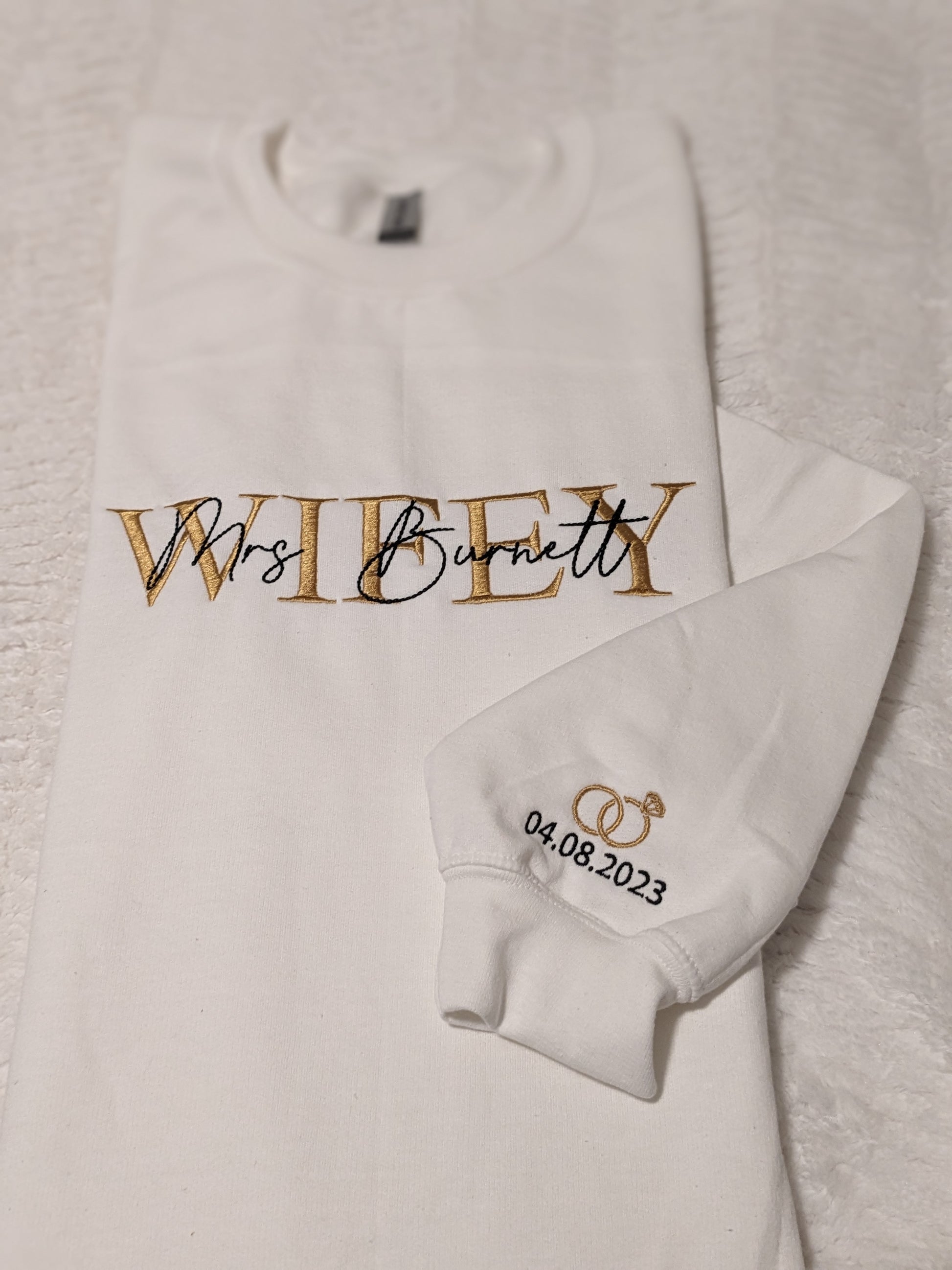 Wifey sweatshirt with Mrs. and last name embroidered on the chest