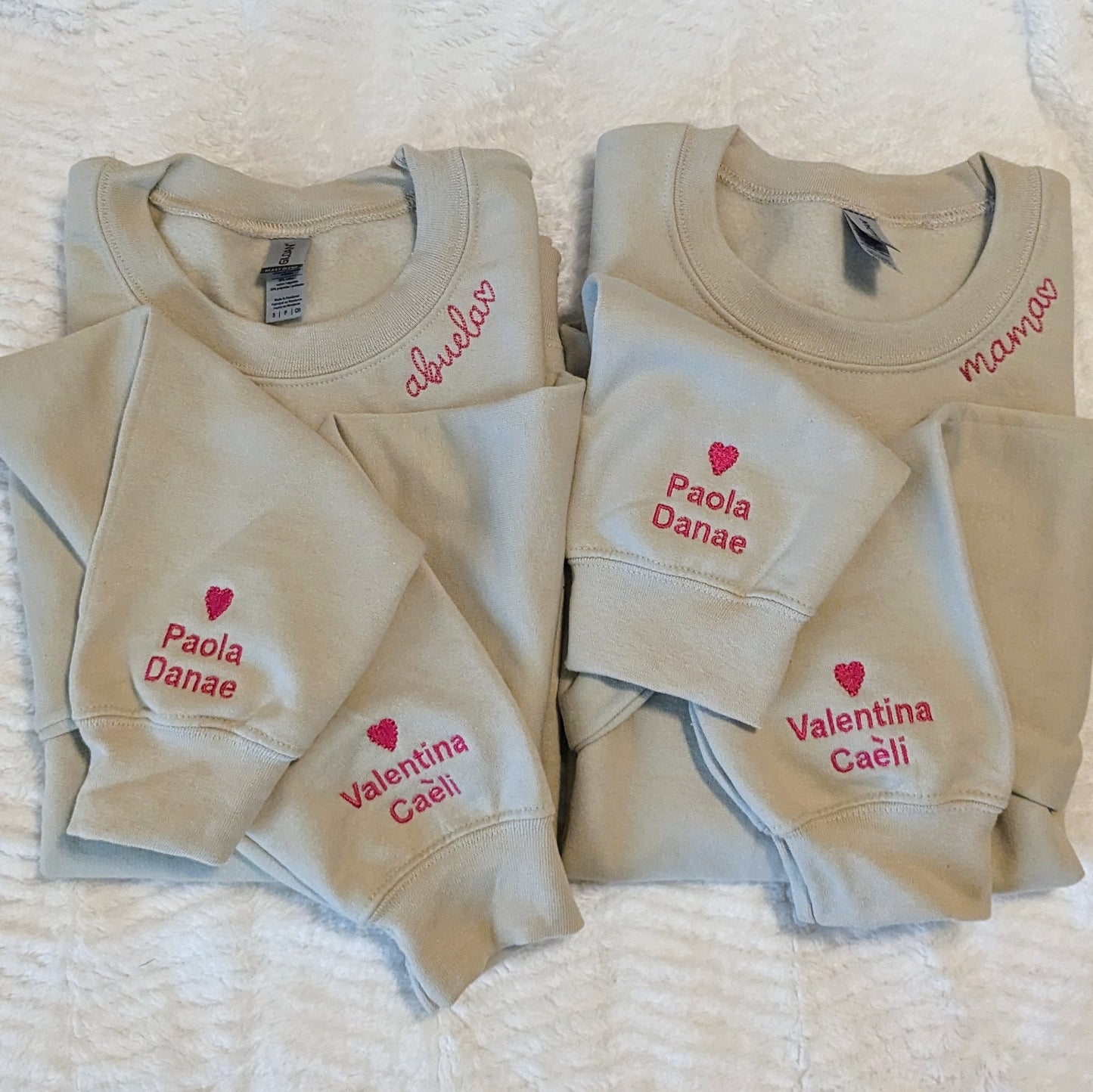 Mama and abuela chain stitch embroidered along the collar of a crewneck sweatshirt