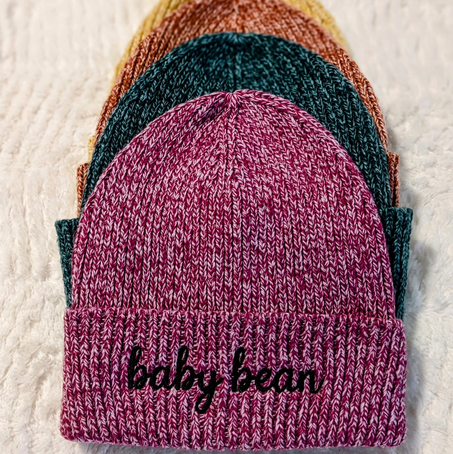 Custom embroidered beanie personalized with a name on the cuff