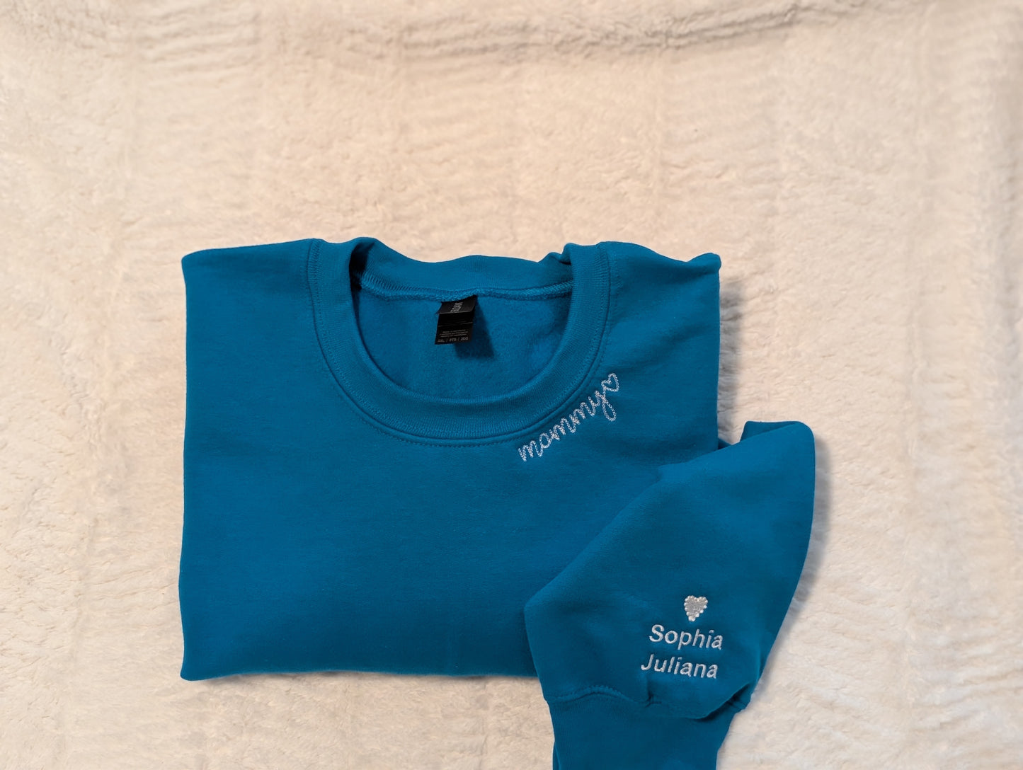 Mommy embroidered along the collar in delicate chain stitch