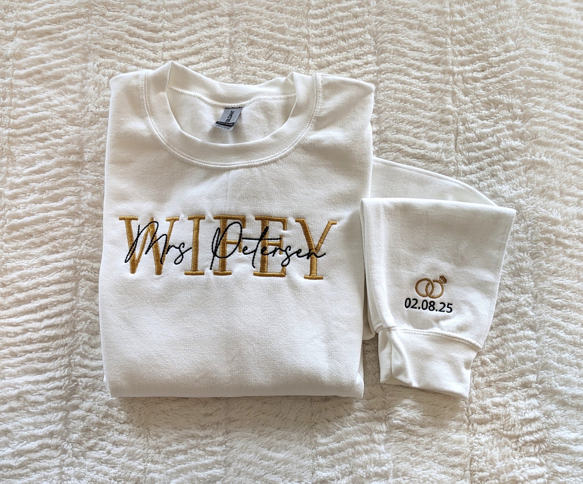 Personalized Wifey crewneck with wedding rings and date on the sleeve