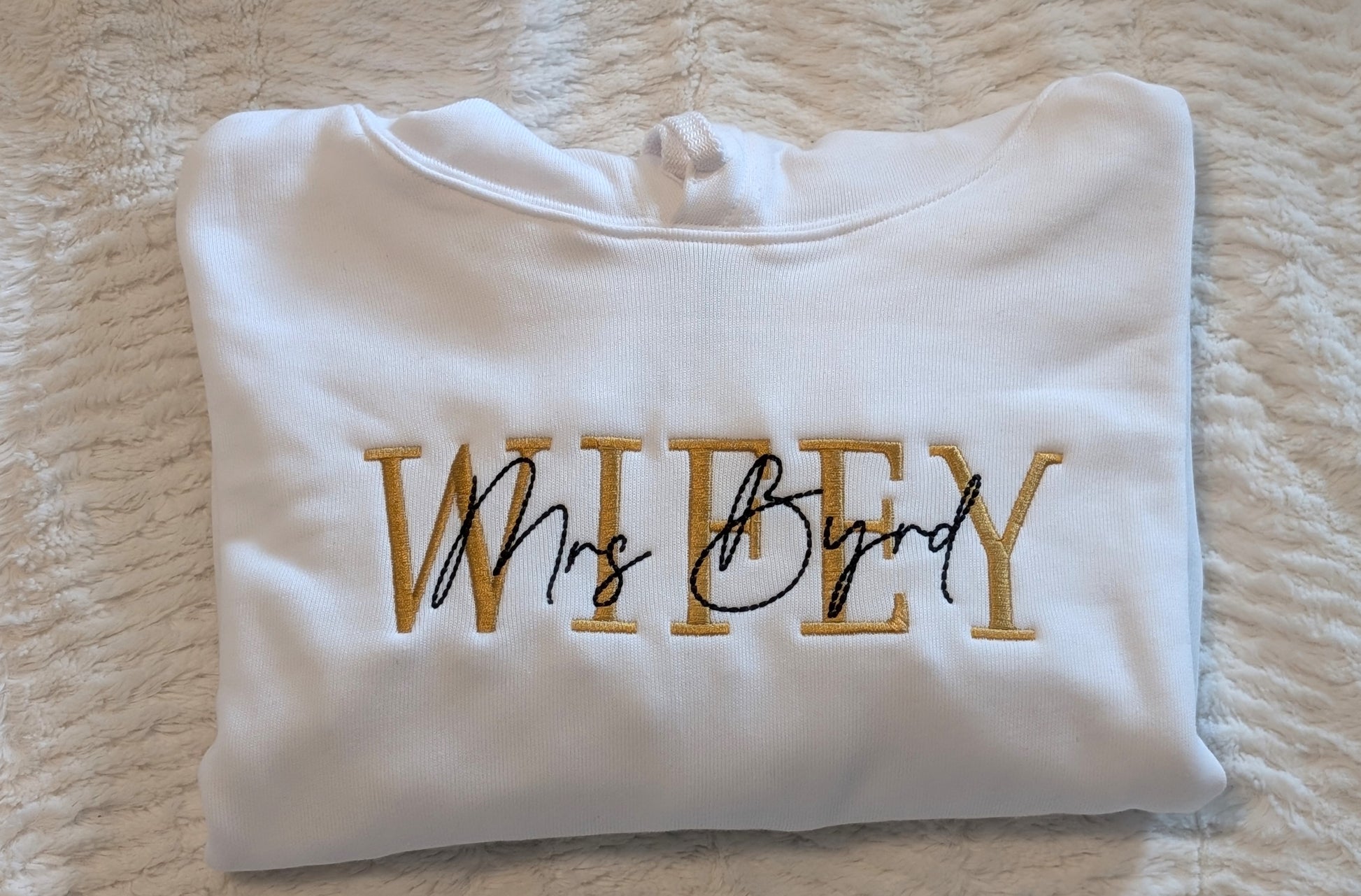 Mrs. last name embroidered Wifey sweatshirt for a bride